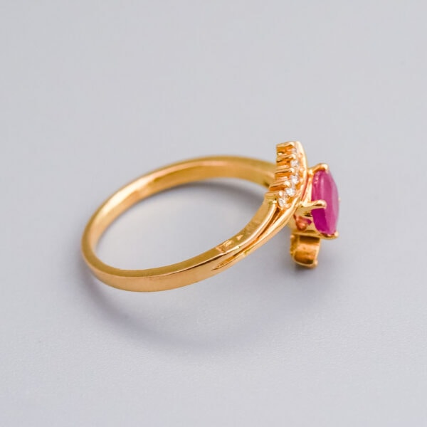 Elegant gold ring with pink gemstone and diamond accents, showcasing fine jewellery craftsmanship by Don Laurence Jewellery in the UK.