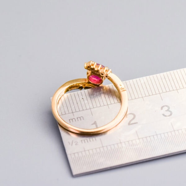 Polished gold ring with pink gemstone and diamond accents, measuring approximately 1.5 cm in diameter, showcasing luxury jewellery from Don Laurence Jewellery.