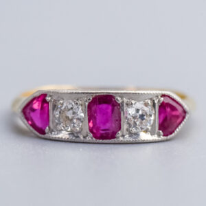Gorgeous gold and silver ring featuring vibrant pink sapphires and sparkling diamonds, perfect for elegant jewellery collections and special occasions.