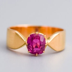 Genuine ruby gemstone engagement ring with 18k yellow gold band, handcrafted fine jewellery from Don Laurence Jewellery, bespoke luxury piece in elegant design.
