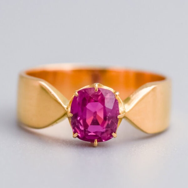 Genuine ruby gemstone engagement ring with 18k yellow gold band, handcrafted fine jewellery from Don Laurence Jewellery, bespoke luxury piece in elegant design.