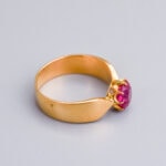 Elegant gold ring with a pink gemstone, bespoke jewellery piece from Don Laurence Jewellery, perfect for special occasions and fine jewellery lovers.