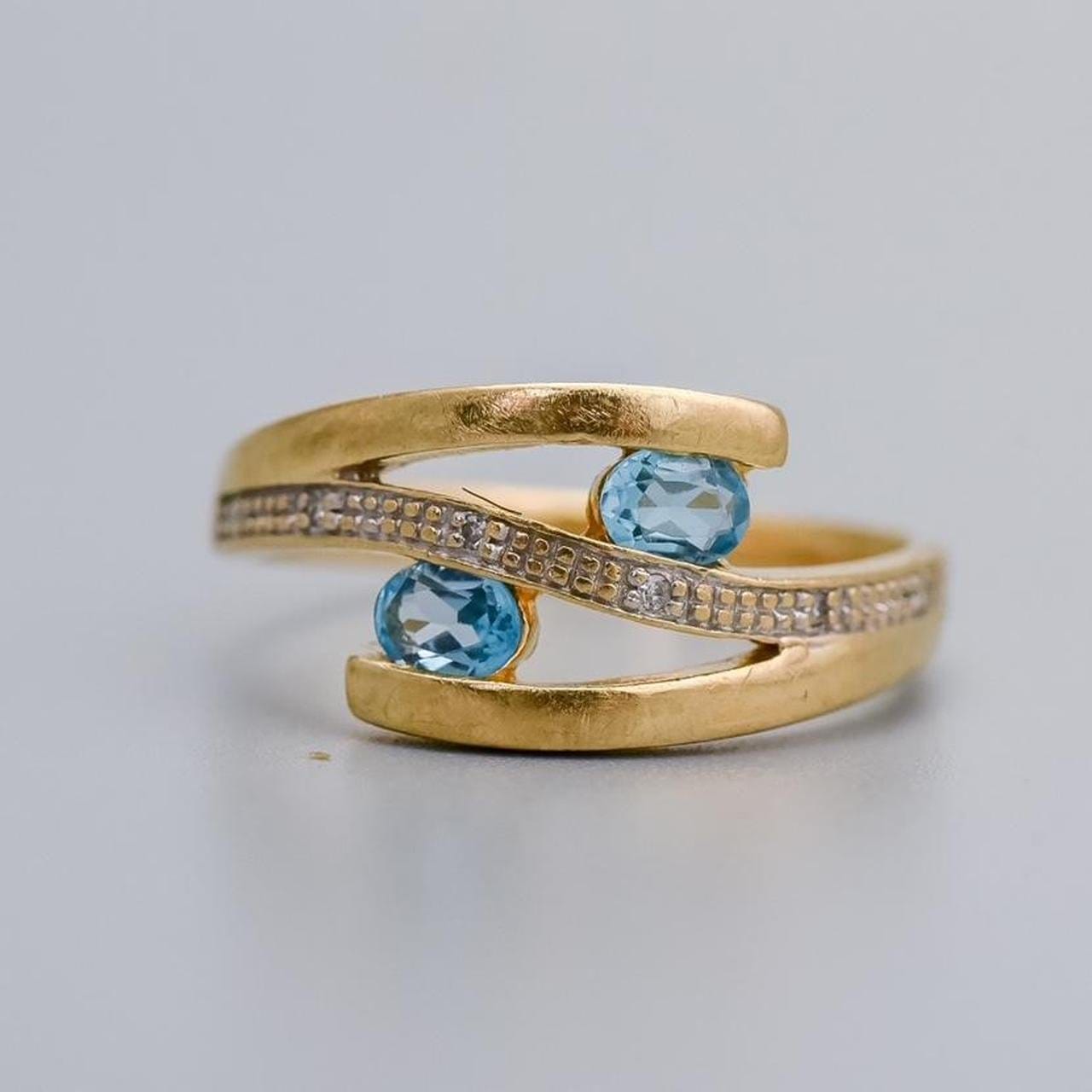 10K Gold Blue Topaz Crossover Ring