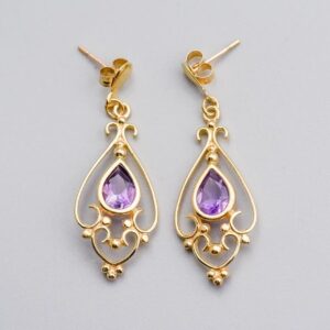 Solid 9K Gold Amethyst Drop Earrings  This pair of 9K gold amethyst drop earrings features a pear-cut amethyst at its centre, elegantly set in a polished gold bezel.   Surrounding the gemstone is intr